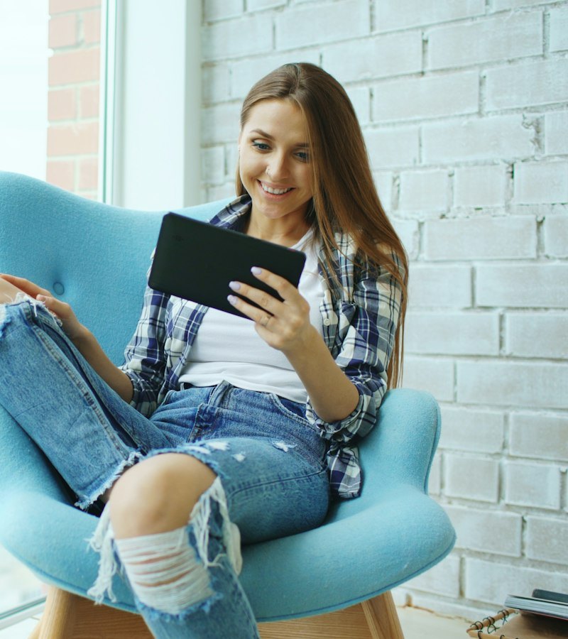 Woman reading wellness tips on a tablet